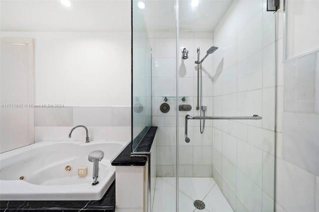 bathroom featuring separate shower and tub and tile patterned flooring