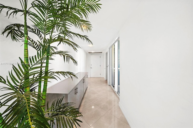 hallway with light tile patterned floors