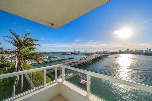 balcony featuring a water view