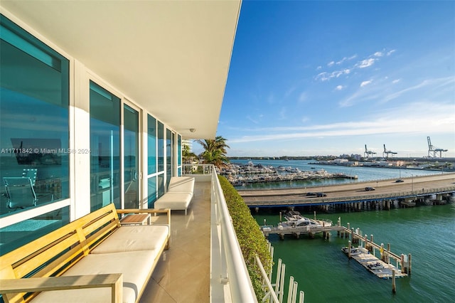 balcony featuring a water view