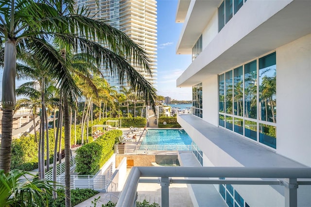 view of pool featuring a water view