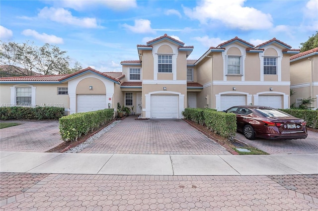 mediterranean / spanish-style house featuring a garage