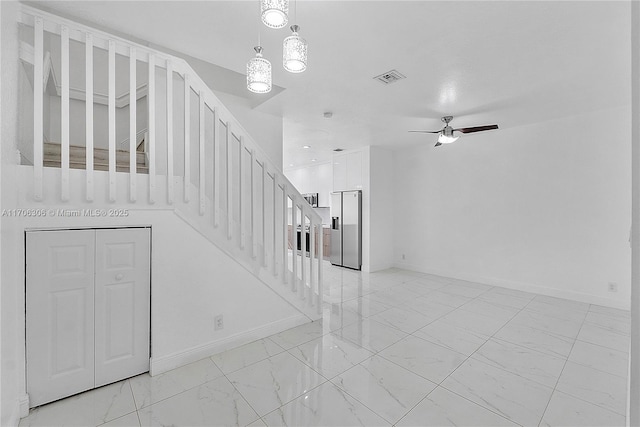 stairs with ceiling fan