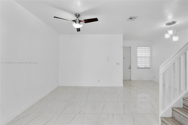 unfurnished room featuring ceiling fan