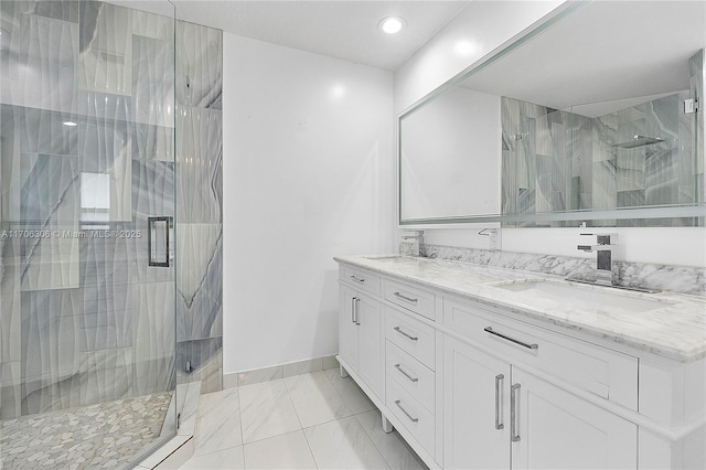 bathroom featuring vanity and a shower with shower door