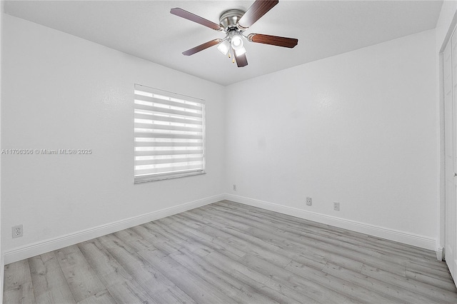 empty room with light hardwood / wood-style flooring and ceiling fan