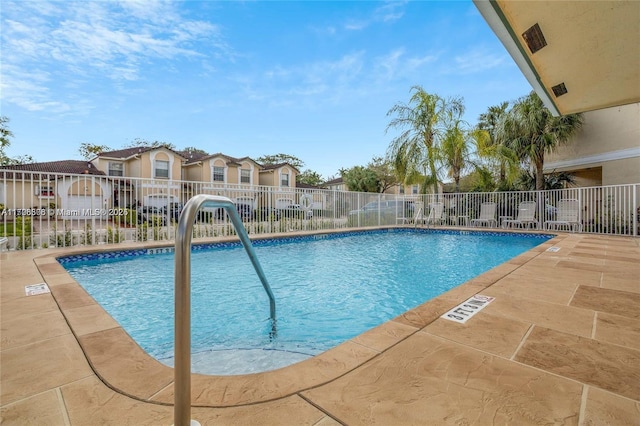 view of swimming pool featuring a patio area