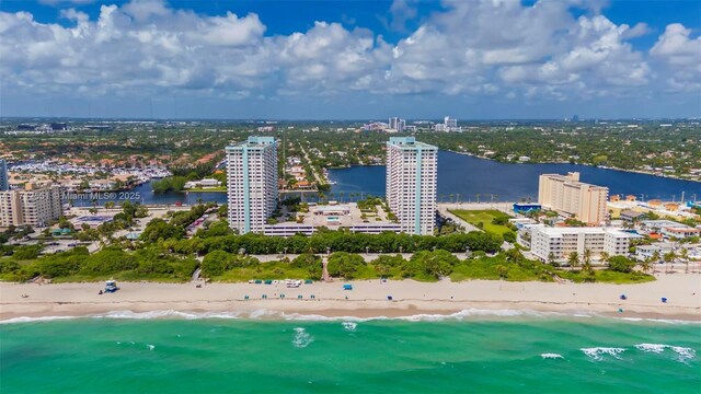 aerial view with a beach view and a water view