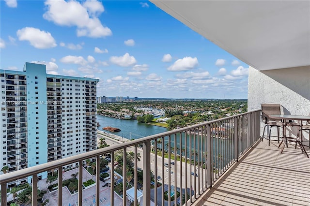 balcony with a view of city and a water view