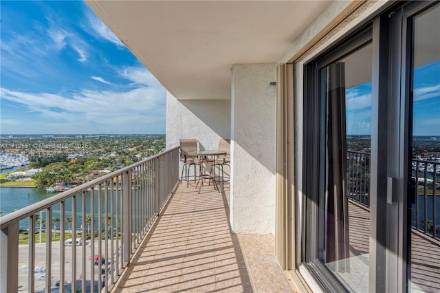 balcony featuring a water view