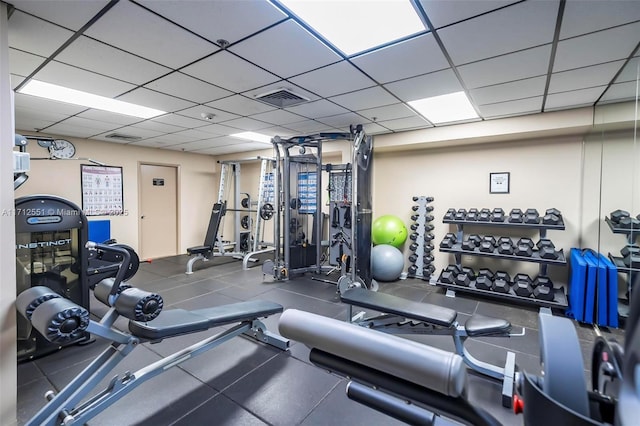 gym with visible vents and a paneled ceiling