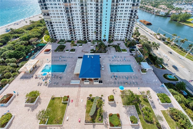 drone / aerial view with a water view and a view of the beach