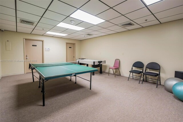 playroom with a drop ceiling, visible vents, and carpet floors