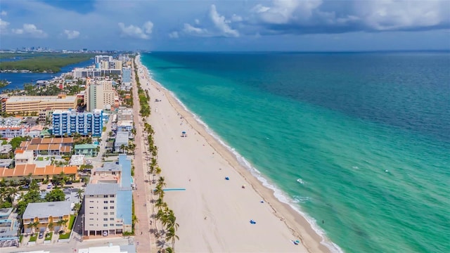 aerial view with a water view, a city view, and a view of the beach