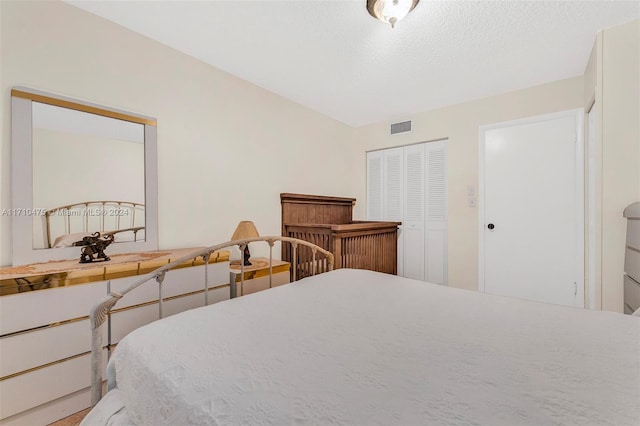 bedroom featuring a textured ceiling