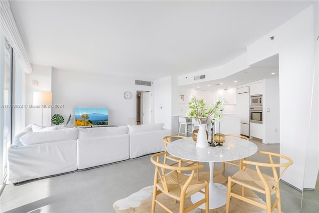 dining room featuring concrete floors