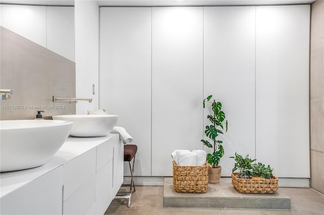 bathroom featuring vanity and concrete floors