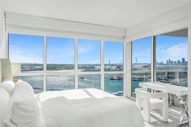 bedroom featuring a water view