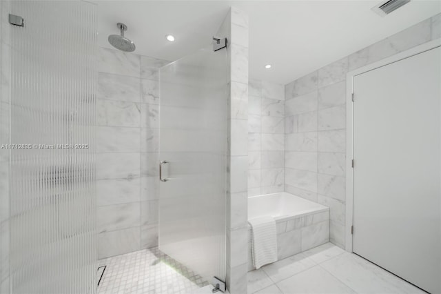 full bath with a garden tub, a shower stall, and visible vents