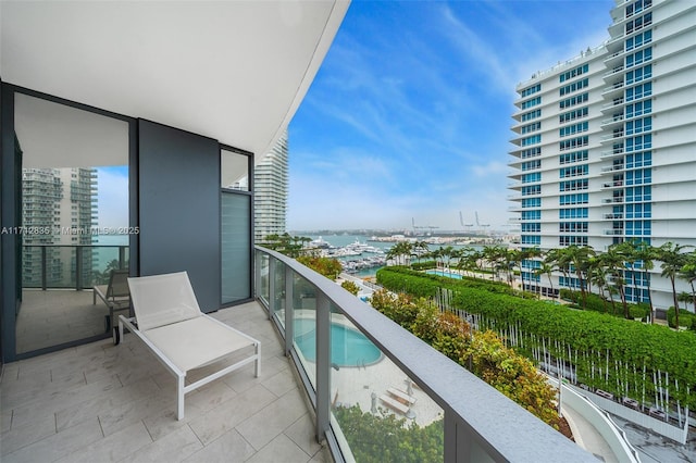 balcony featuring a water view