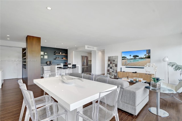 dining room with dark hardwood / wood-style flooring