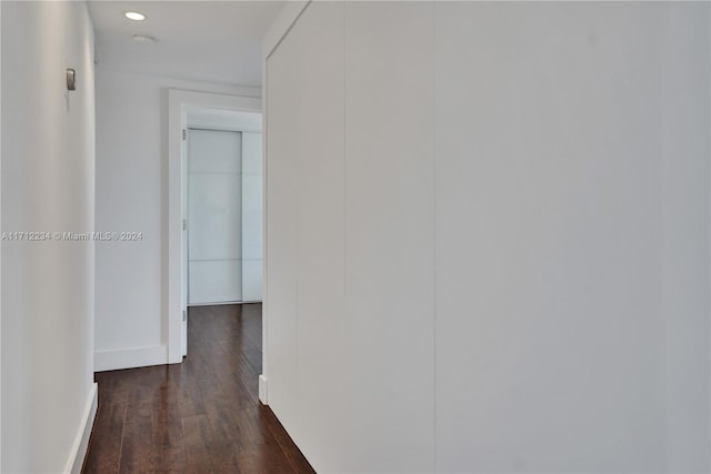 corridor featuring dark hardwood / wood-style flooring