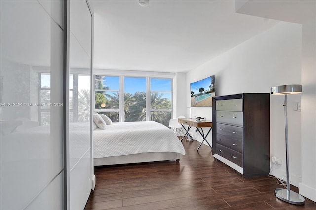 bedroom featuring dark hardwood / wood-style flooring