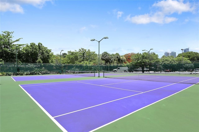 view of tennis court featuring basketball court