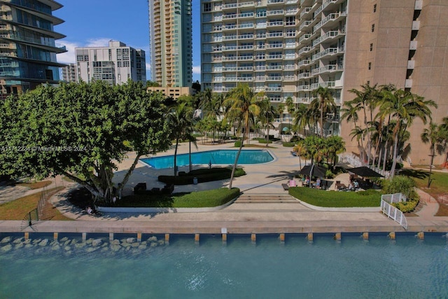 view of swimming pool with a water view