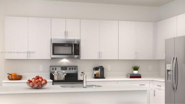 kitchen featuring white cabinets, sink, and stainless steel appliances