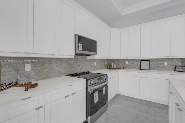 kitchen with stainless steel appliances and white cabinets