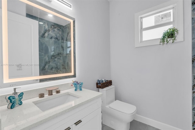 bathroom featuring vanity, a shower, and toilet