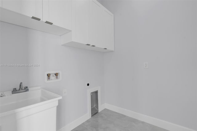 laundry area with cabinets, hookup for a washing machine, and electric dryer hookup