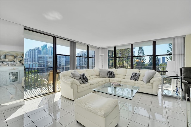 living room featuring expansive windows and light tile patterned floors