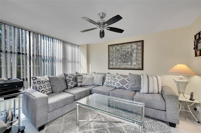 living room featuring light tile patterned floors and ceiling fan