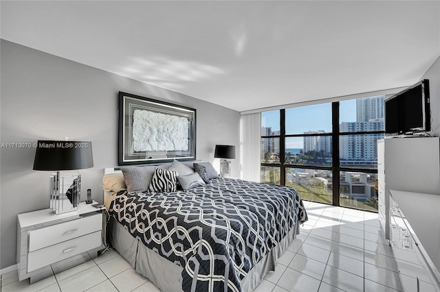 tiled bedroom with expansive windows