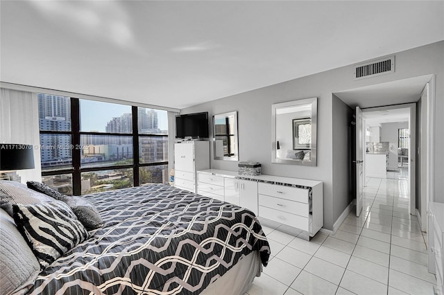 bedroom featuring light tile patterned flooring