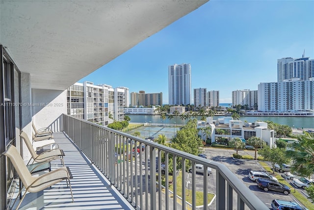 balcony featuring a water view