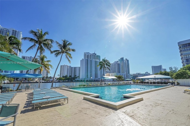 view of swimming pool featuring a patio area