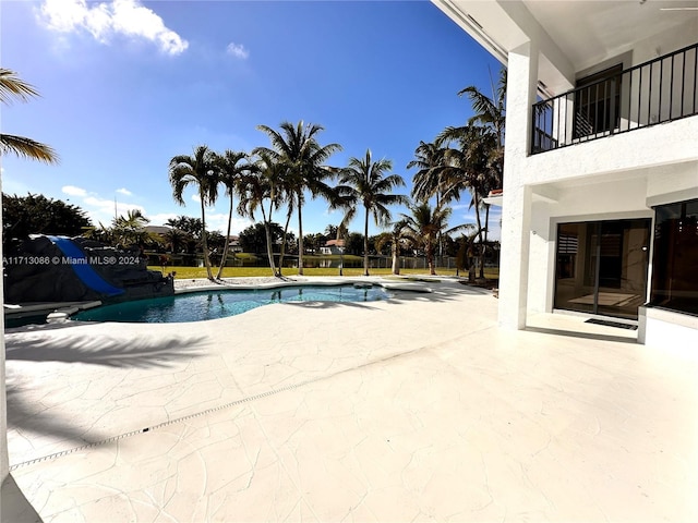 view of swimming pool with a patio