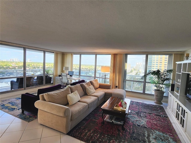 tiled living room featuring expansive windows and a textured ceiling