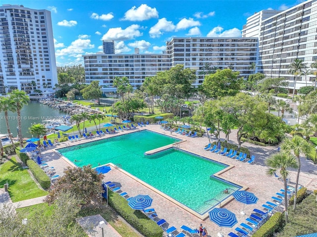 view of swimming pool featuring a water view