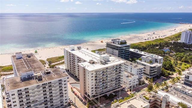 aerial view featuring a view of the beach and a water view