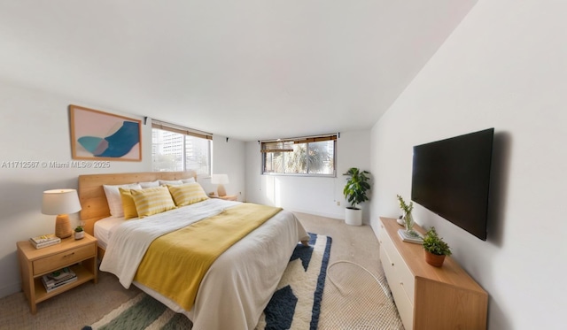 bedroom featuring light colored carpet