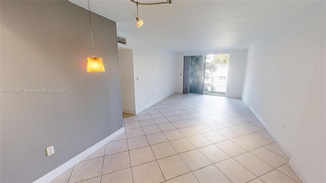 unfurnished room with light tile patterned floors