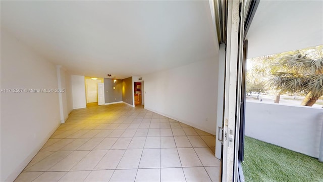 empty room with light tile patterned flooring