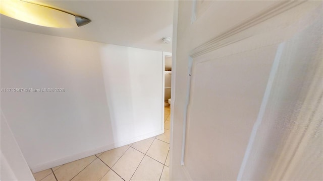 hallway featuring light tile patterned floors