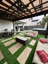 exterior space with ceiling fan and an outdoor hangout area