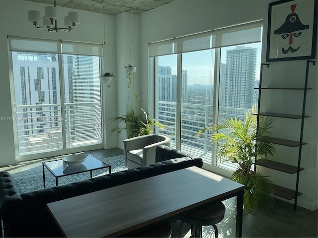 dining area with a view of city and a notable chandelier