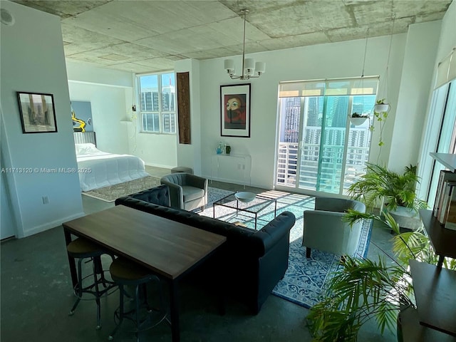 dining space with a notable chandelier and baseboards